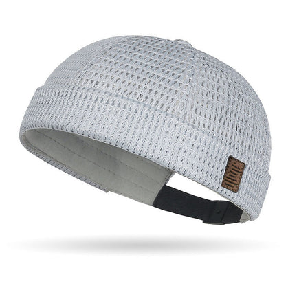 Breathable mesh cap with an adjustable strap