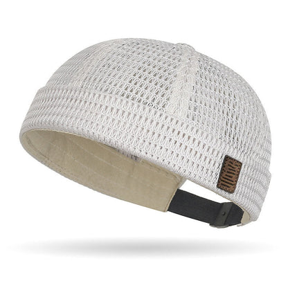Breathable mesh cap with an adjustable strap